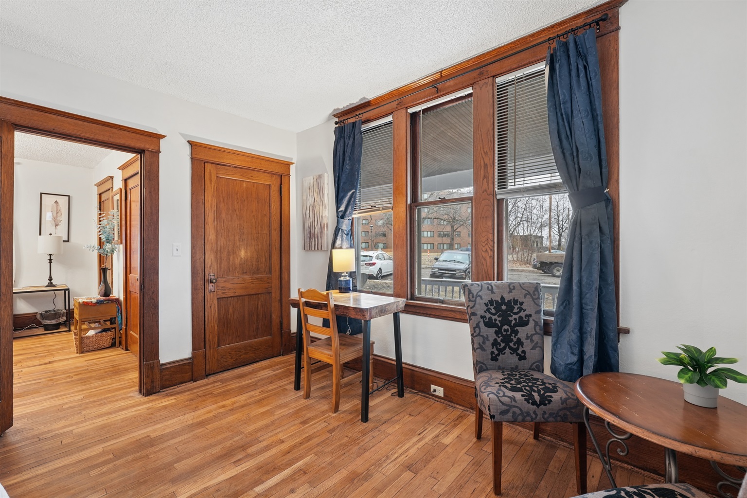 The king bedroom offers a live-edge wooden desk and cozy seating nook for two.