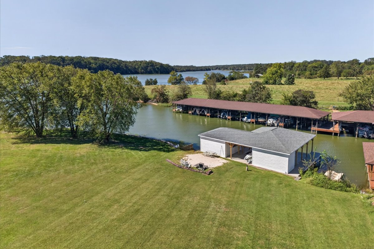 The perfect spot: sandy beach, boathouse, and quiet lake cove.