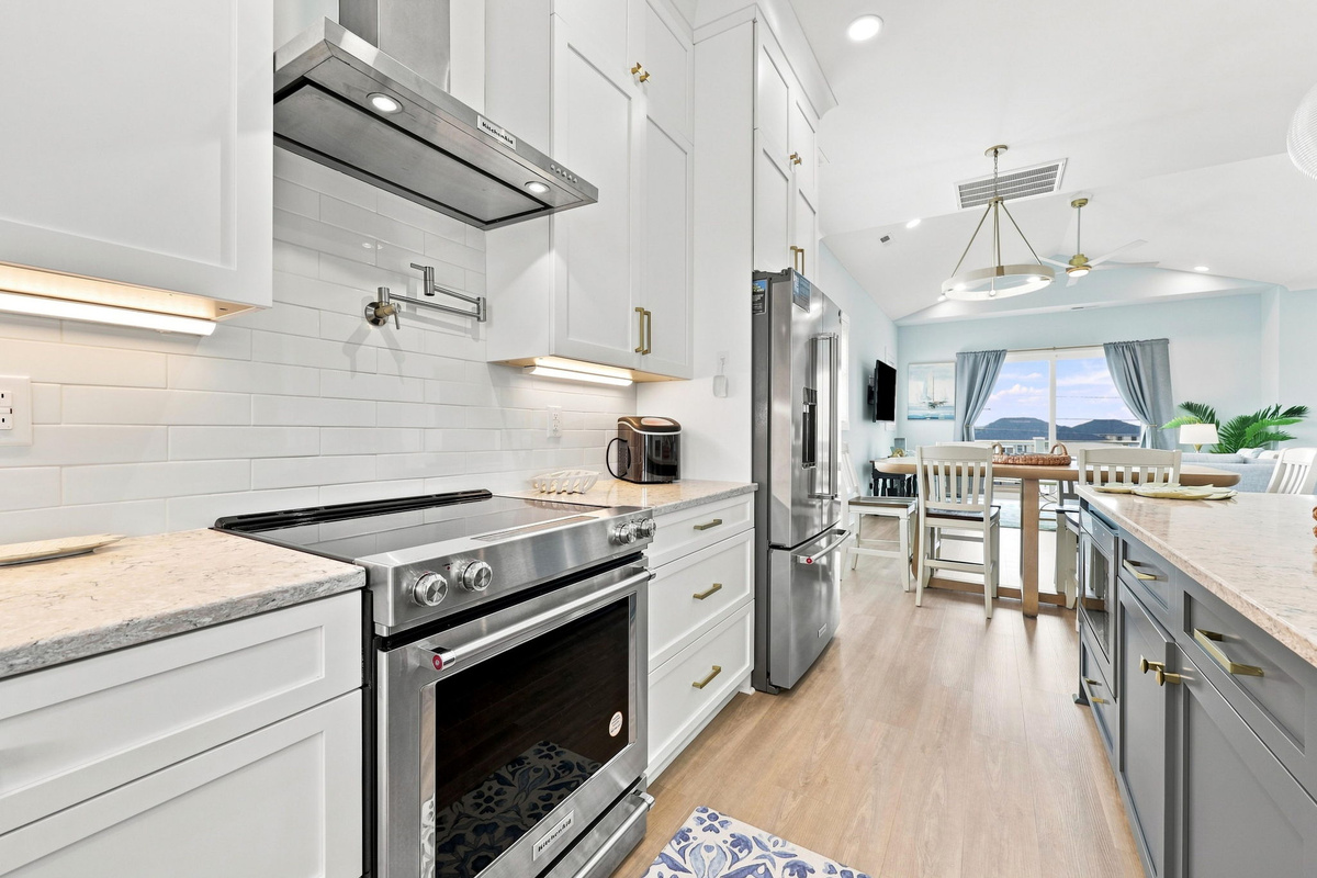 Cook with ease in this beautifully designed kitchen featuring stainless steel appliances, ample storage, and a seamless connection to the main living spaces