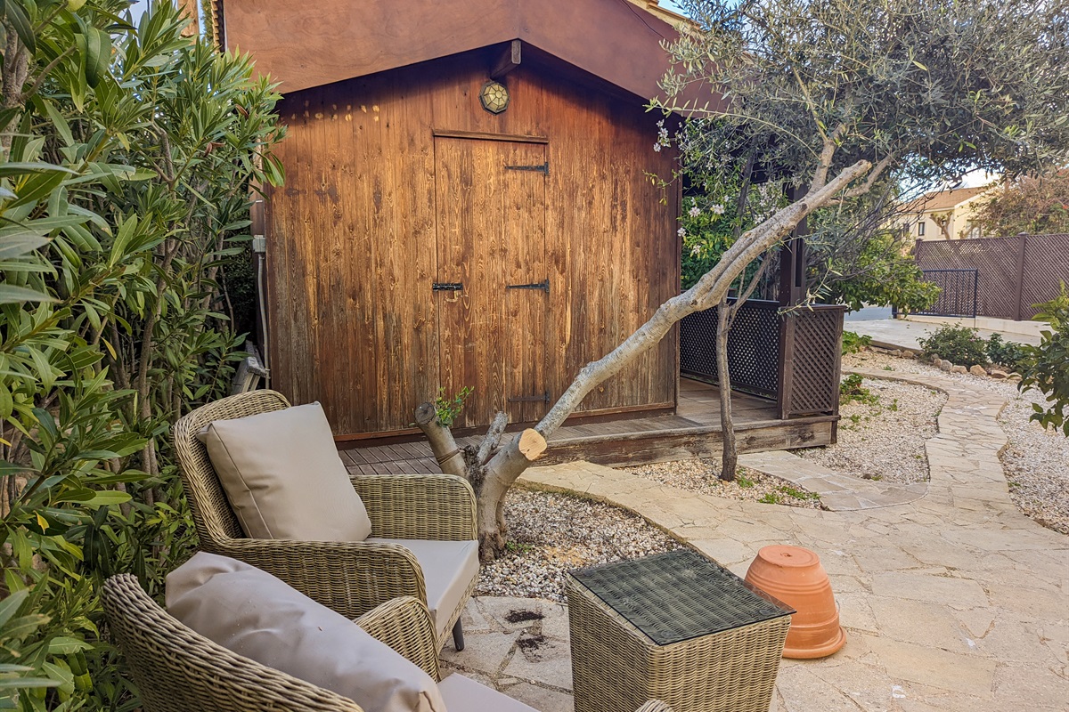 Relax in another cozy seating nook in the front yard, where you can chase the sun or lounge in the shade depending on the time of day.