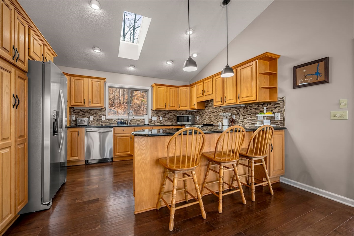 Fully stocked kitchen with stainless steel appliances and more
