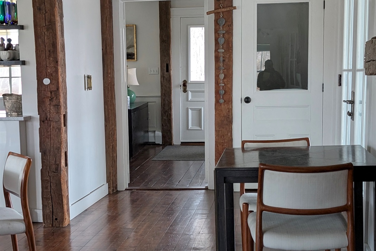 Sunlit Dining & Entryway
“Bright and welcoming dining area with original wood floors and charming historic details.”