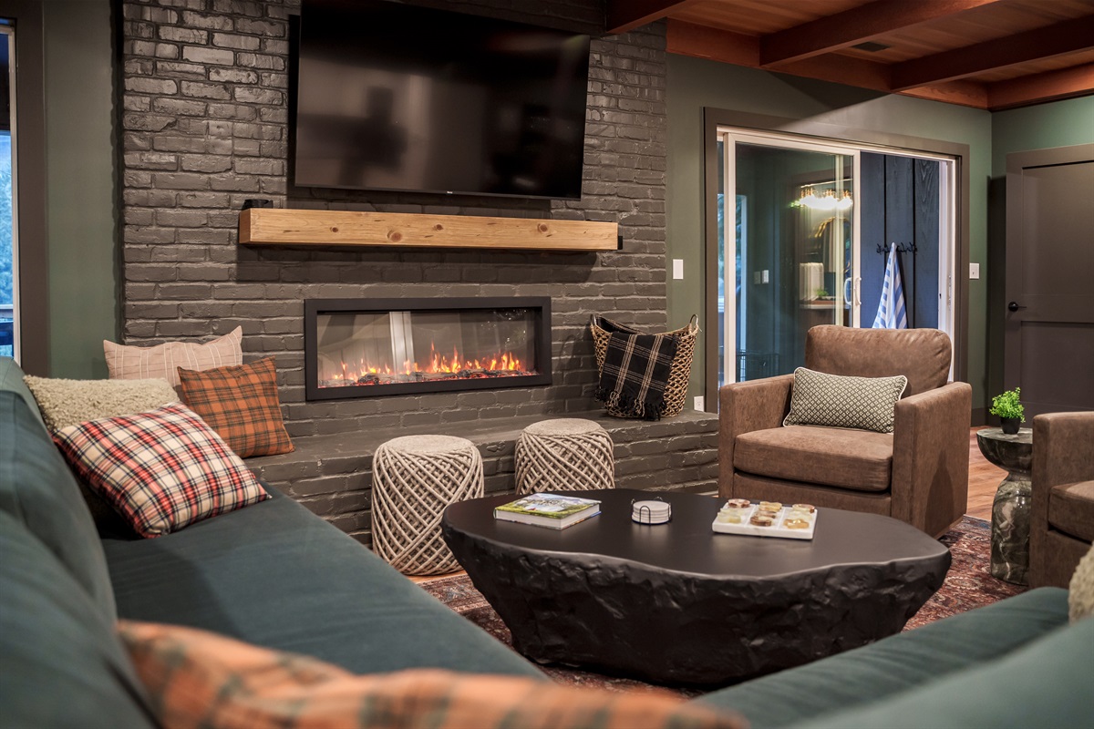 Cozy up around the modern fireplace with plush seating and mountain-inspired décor, the perfect place to unwind after a day on the slopes or trails.