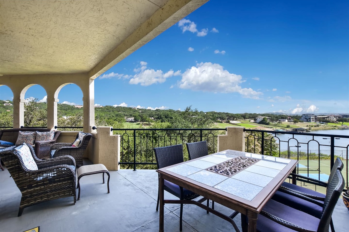 Spacious Patio with Dining Table and Seating Areas