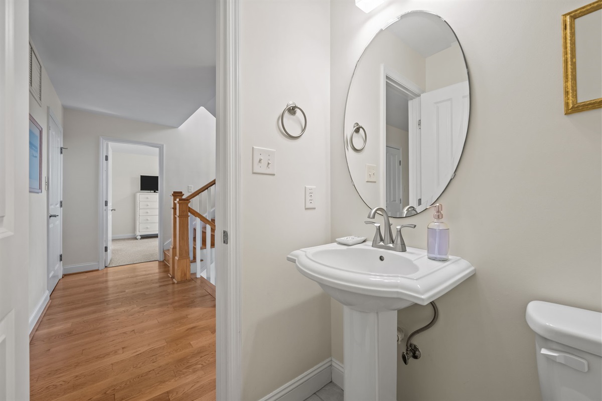 Convenient 1st-floor powder room just off the main hallway