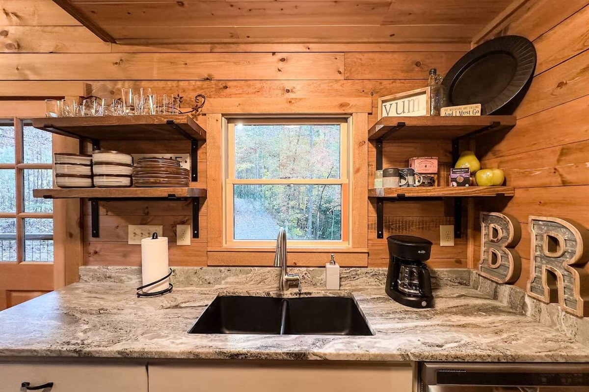 Our sink gleams with cleanliness, accompanied by meticulously arranged table amenities, inviting you to indulge in a seamless blend of functionality and elegance in your cabin retreat