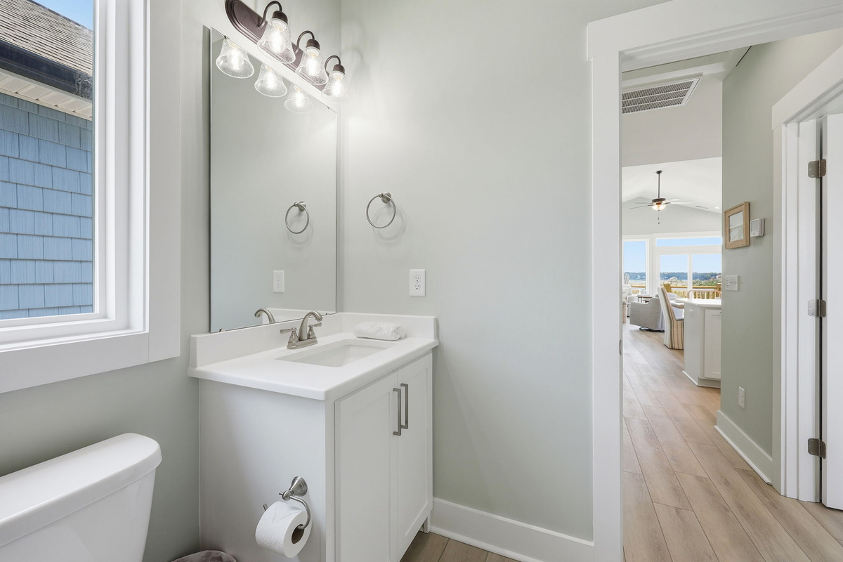 A modern vanity with ample counter space and bright lighting makes getting ready for the day simple and convenient