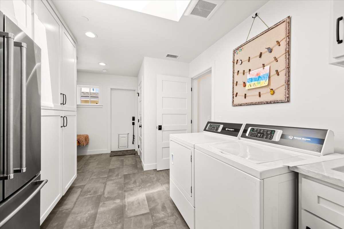 Large laundry space with wash sink and 2nd refrigerator 