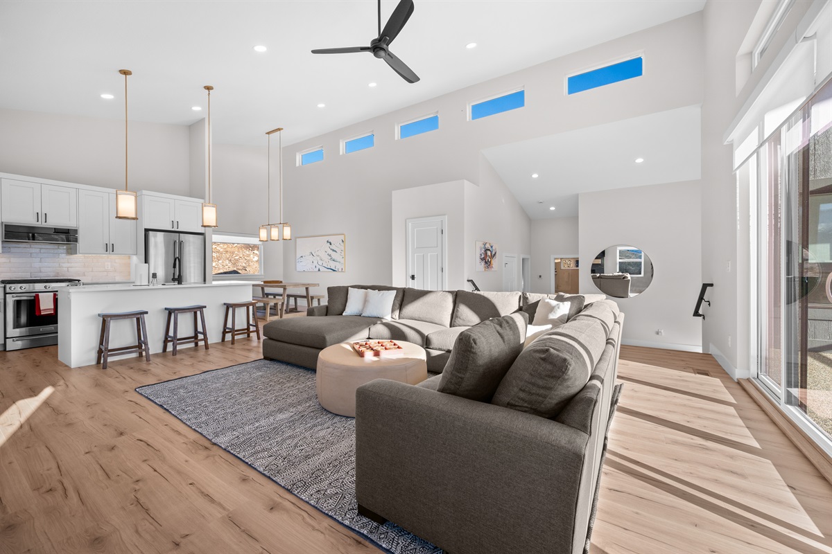 Gourmet kitchen with quartz countertops, stainless appliances, and bar seating for four.