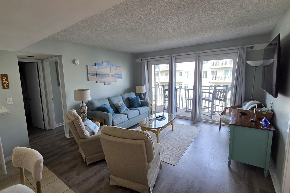Spacious family room opens to the balcony.