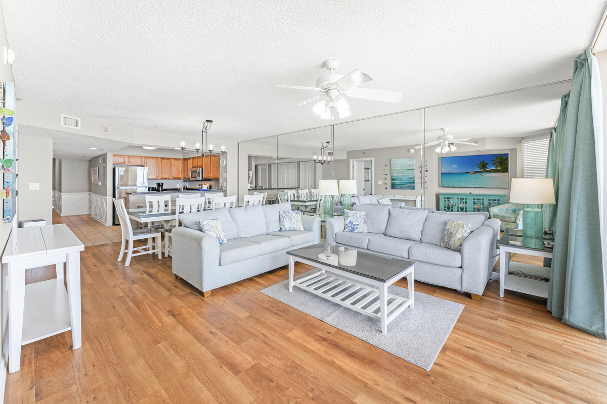 Oceanfront Spacious Living Room with balcony access and large TV