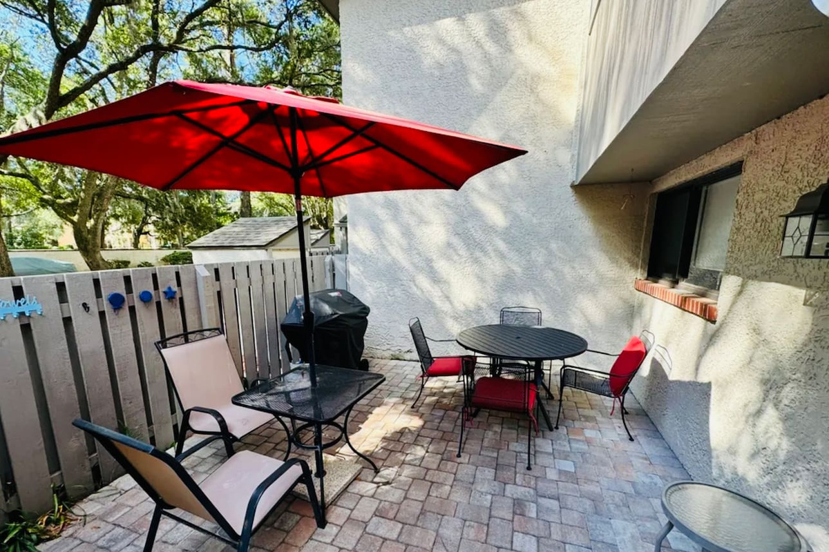 Patio with umbrella and grill