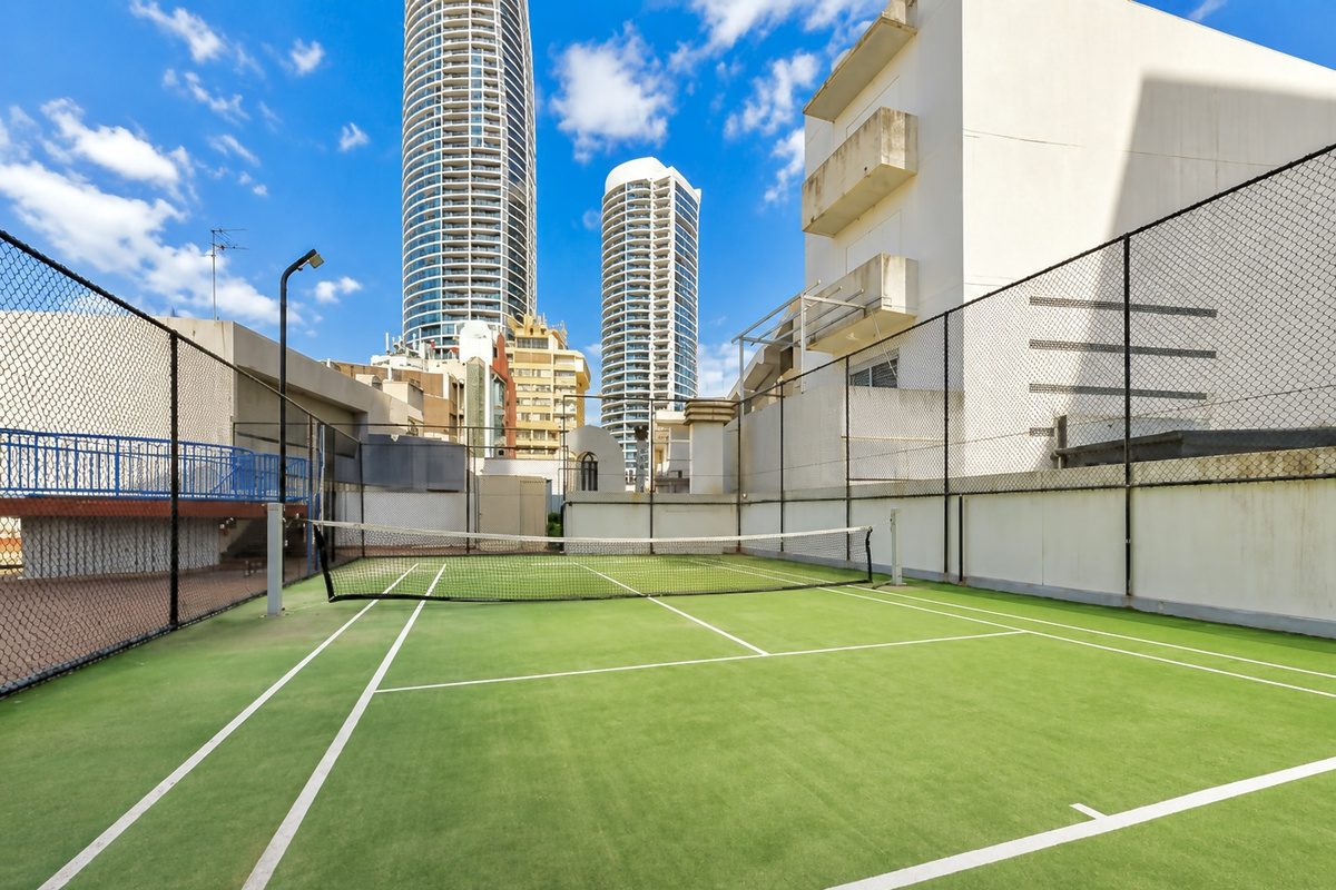 Guests have access to this building tennis court, giving the apartment an extra recreation option close to the pool and shared facilities.