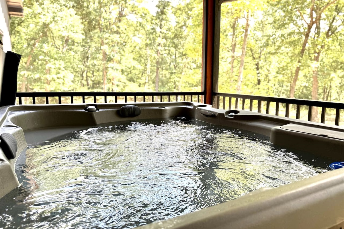 Sit in the four-person hot tub surrounded by a wooded lot and enjoy the sights and sounds of nature bug-free on the screened-in porch. 