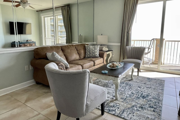 Living room with queen sleeper sofa opens to 21 ft. balcony - spectacular views.