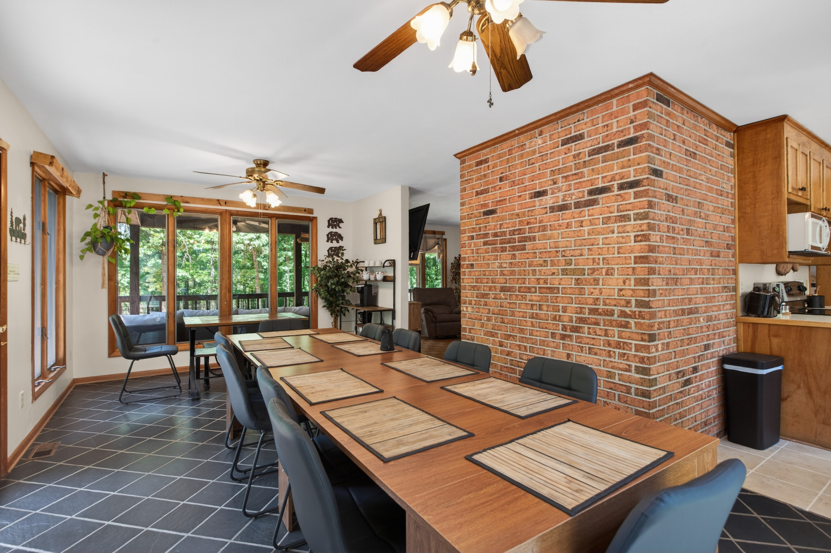 Dining Room: Gather around the stylish table with views of nature and warm, inviting decor!