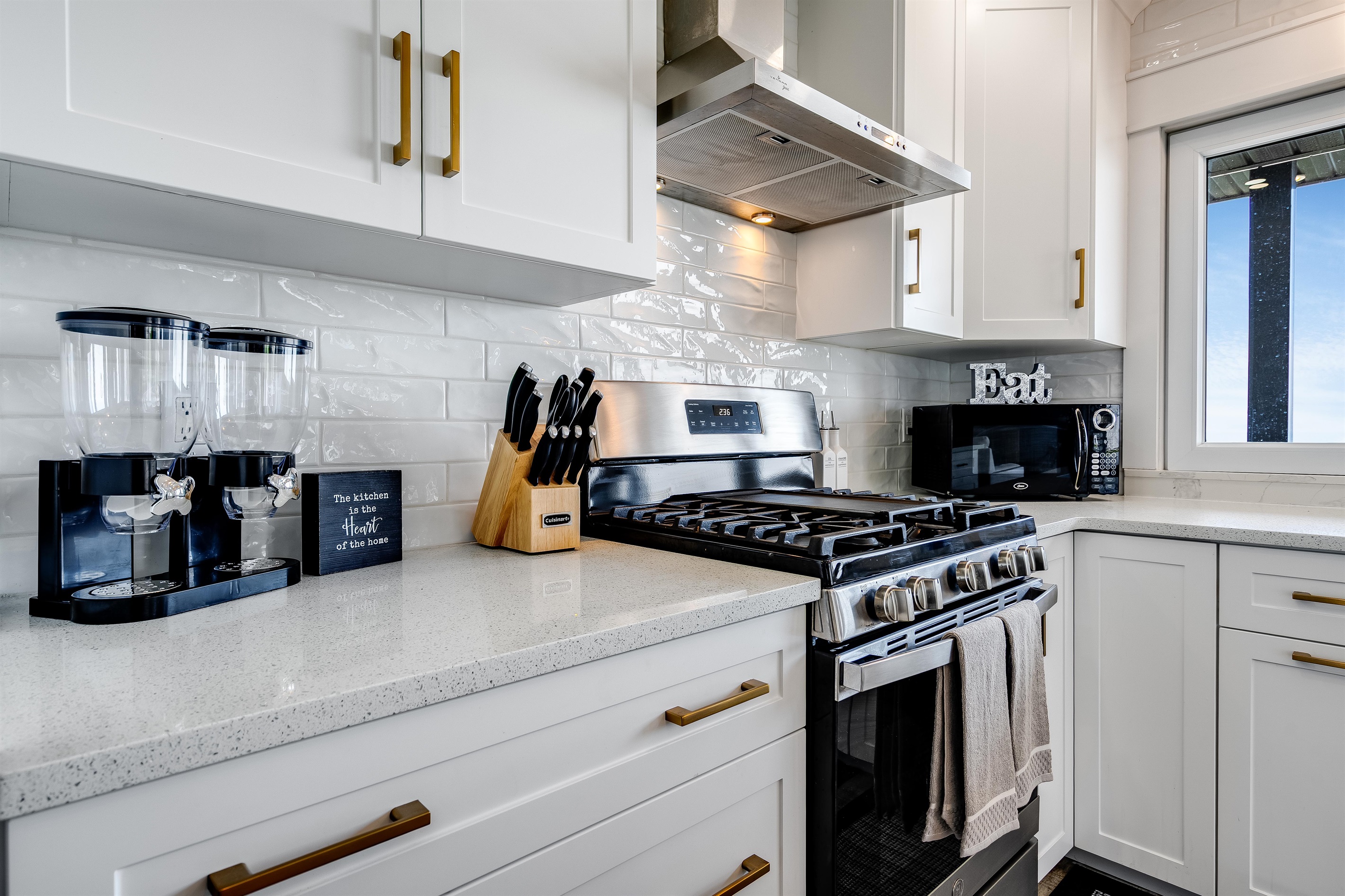 Matte black fixtures and stainless steel appliances