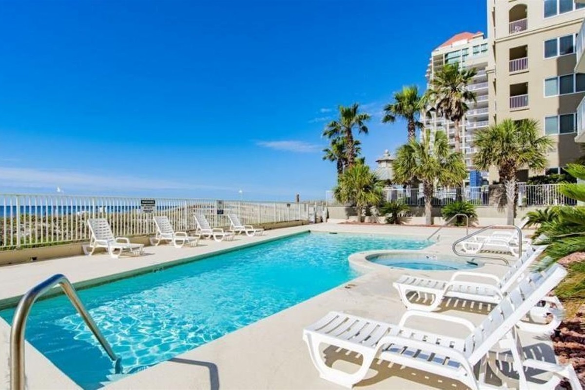 Where the pool meets the ocean.  Enjoy a seamless blend of relaxation and recreation in this idyllic beachfront setting.