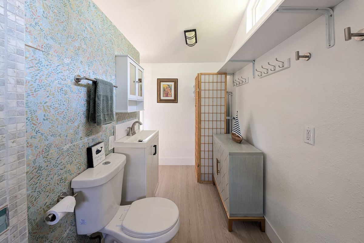 Roomy bathroom with convenient storage space.