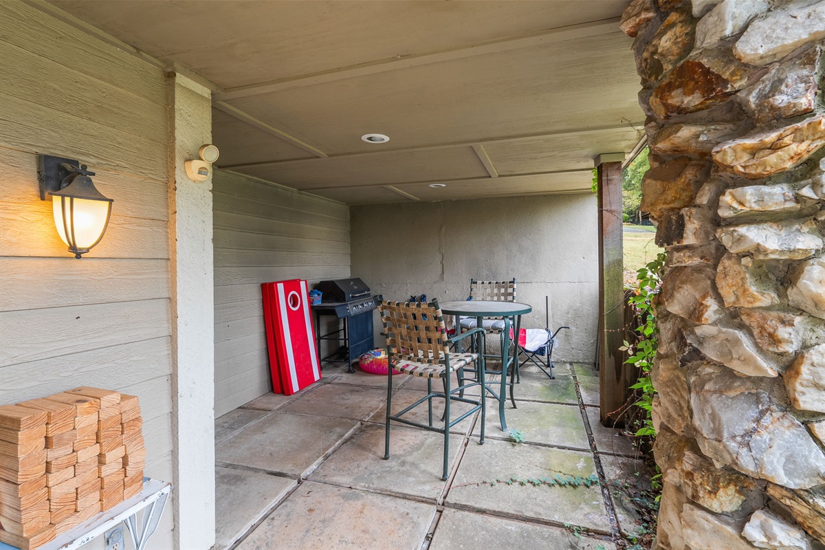 Covered lower patio with lake toy storage.