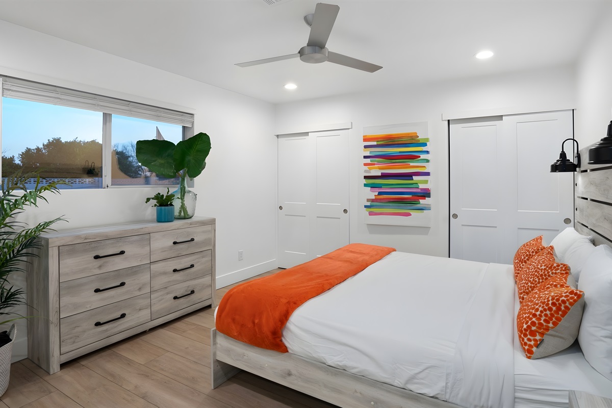 Primary Bedroom - Enjoy views of the relaxing backyard from your suite