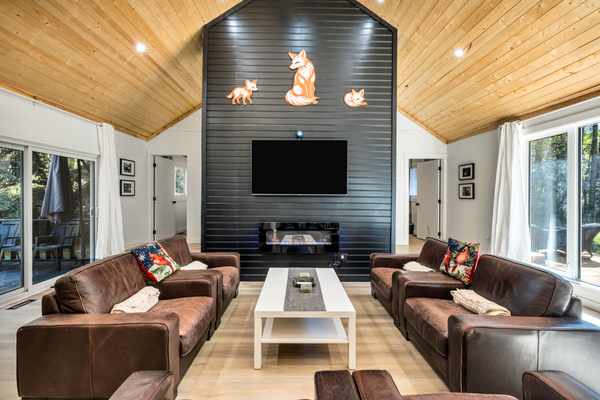 Sink into the comfortable living room, warm up by the fireplace, and unwind together after a day at the lake or exploring the area.
