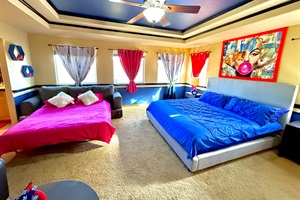 The master's bedroom boasts a luxurious king bed and a queen pull-out couch for added comfort.
