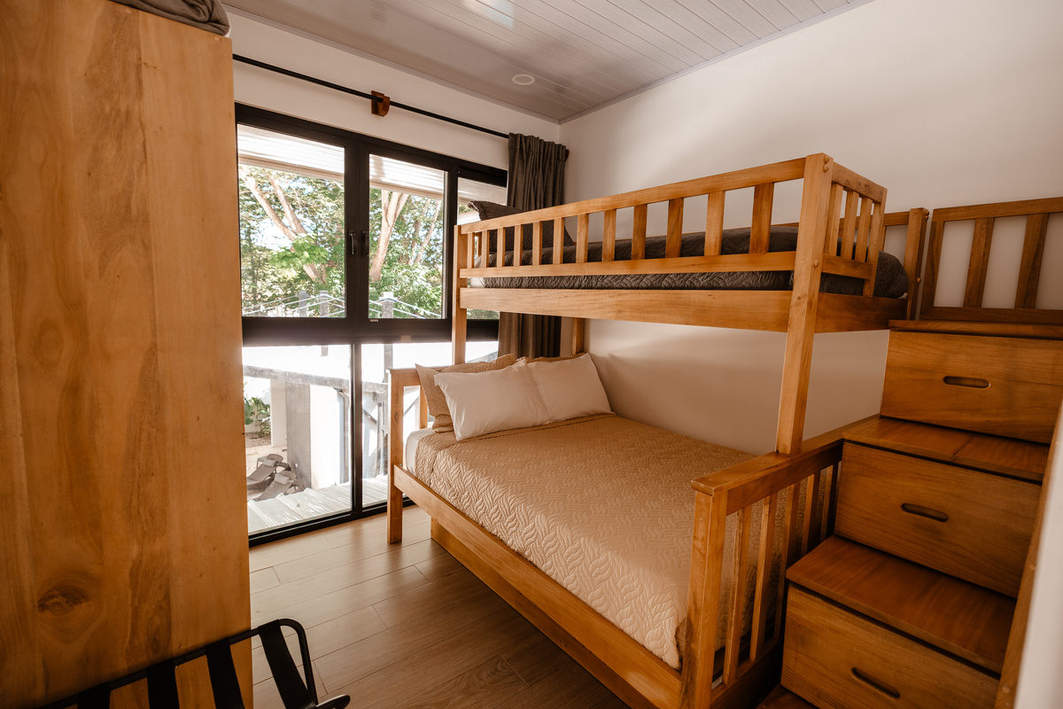 The bunk room. Built-in stairs, double bottom bed for two, plus a single up top