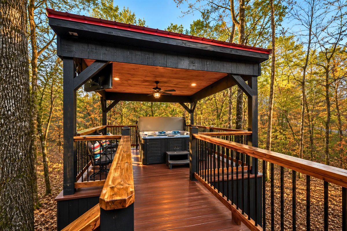 As the sun begins to set, warm lighting across the exterior makes the cabin feel especially welcoming.