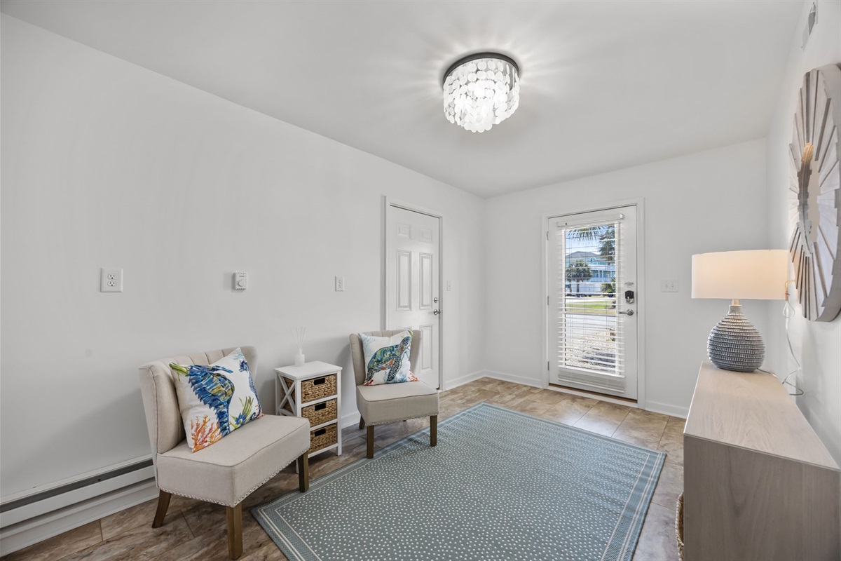 Ground-level entry with seating area: a great space to relax, store beach gear, or unwind after a day at the beach