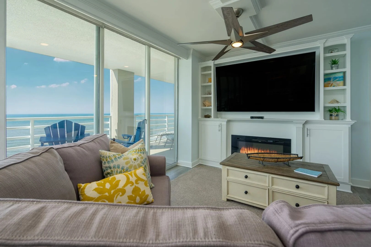 Amazing views from Living room area with fireplace, large TV and balcony access