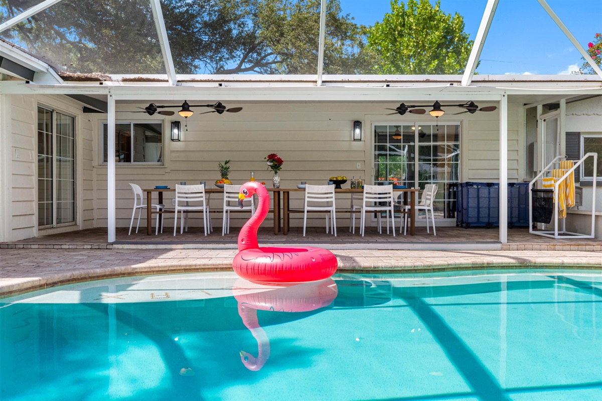 Covered lanai connects seamlessly to the pool for indoor-outdoor living.