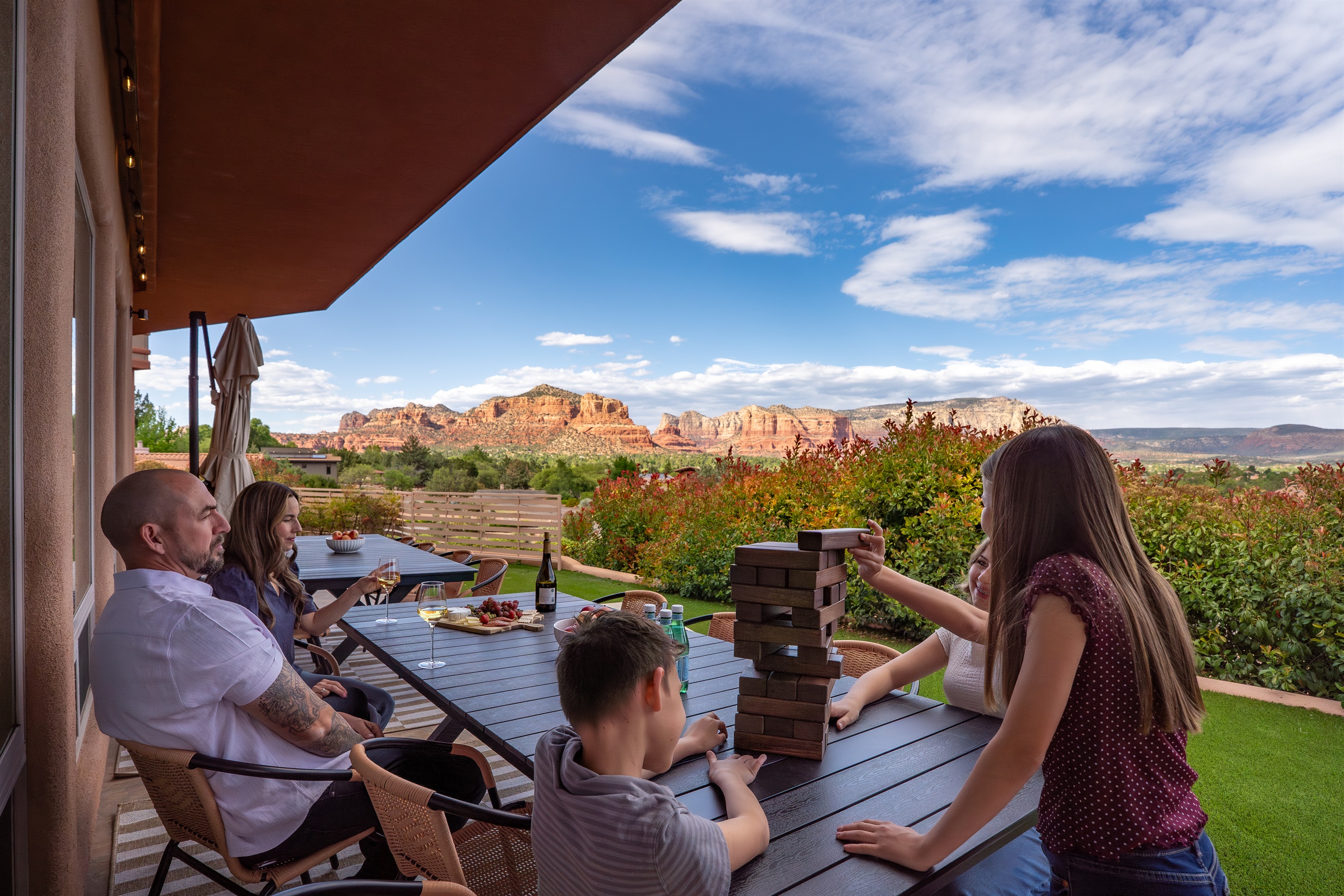 Unforgettable family moments await at Elara Retreats. Enjoy spacious outdoor dining and games with a breathtaking, unobstructed red rock backdrop.