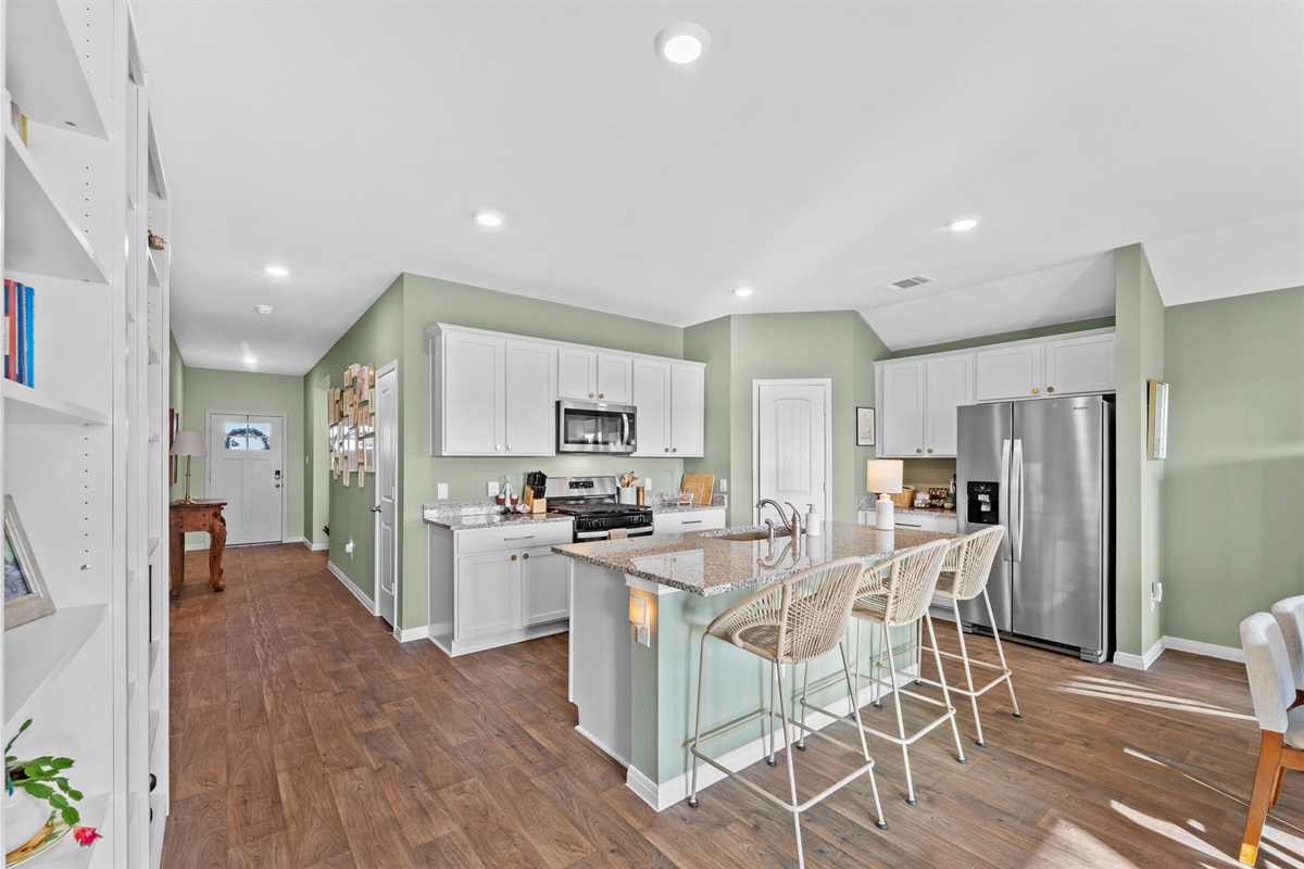 No need to cook alone with 3 additional seats at the island