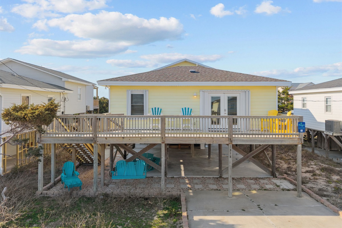 An elevated ocean-side cottage with spacious wraparound balconies&mdash;perfect for outdoor lounging and coastal breezes