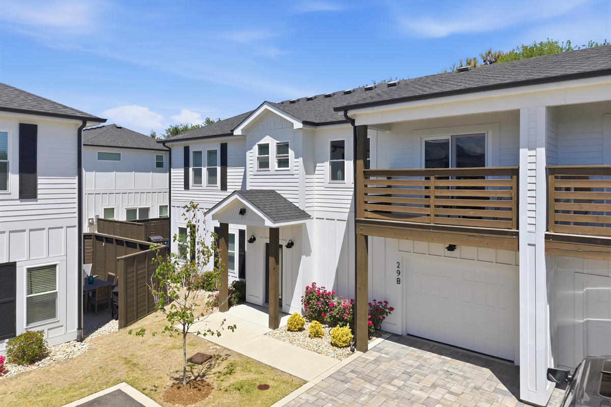 Front exterior with private driveway and garage