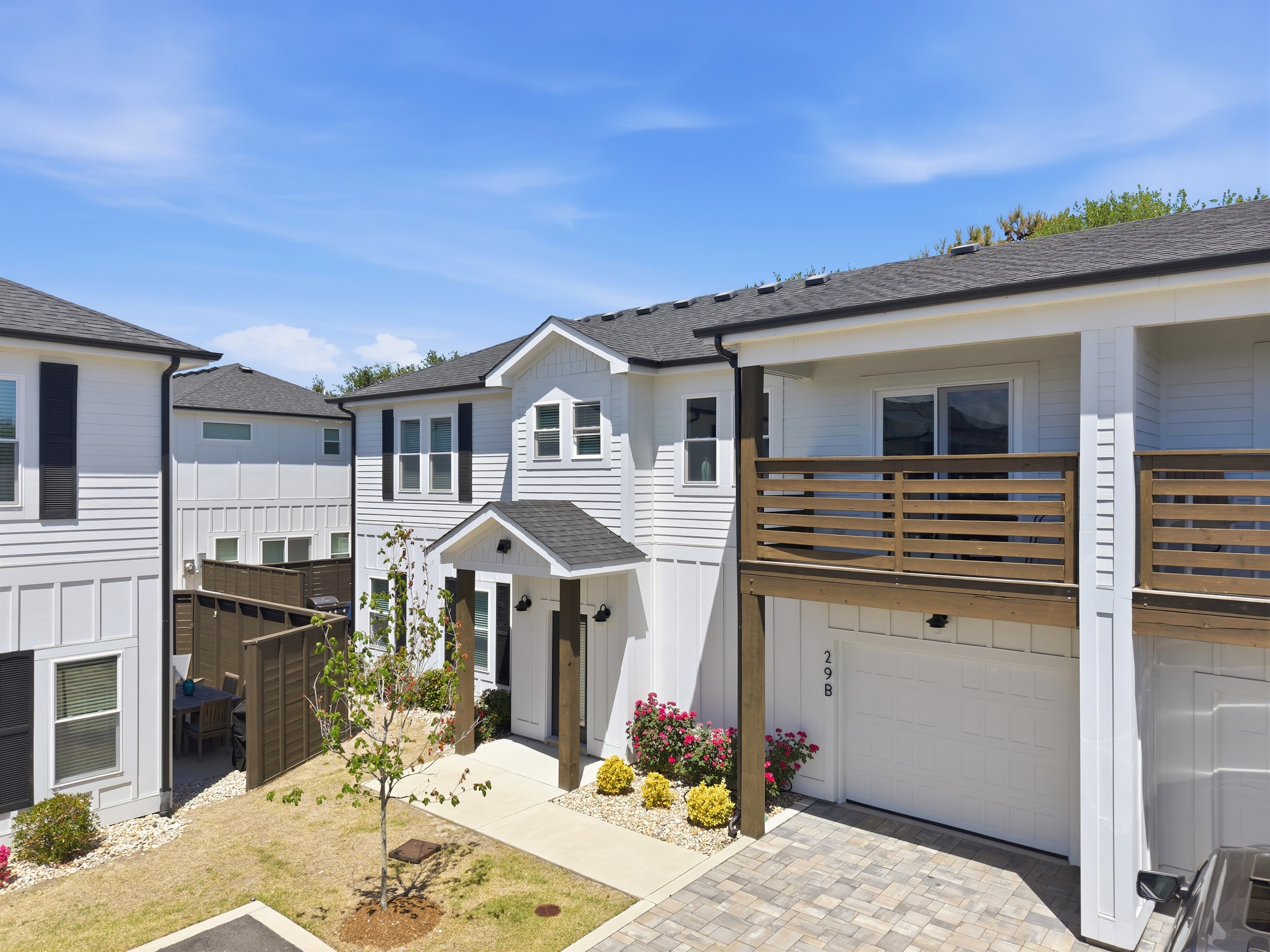 Front exterior with private driveway and garage