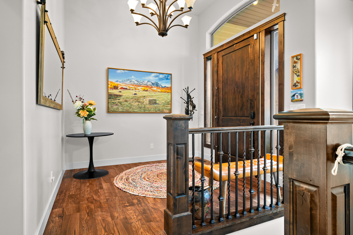 Step inside to a bright, open foyer that welcomes you to this spacious mountain retreat in the Chalets at Edgewater community.