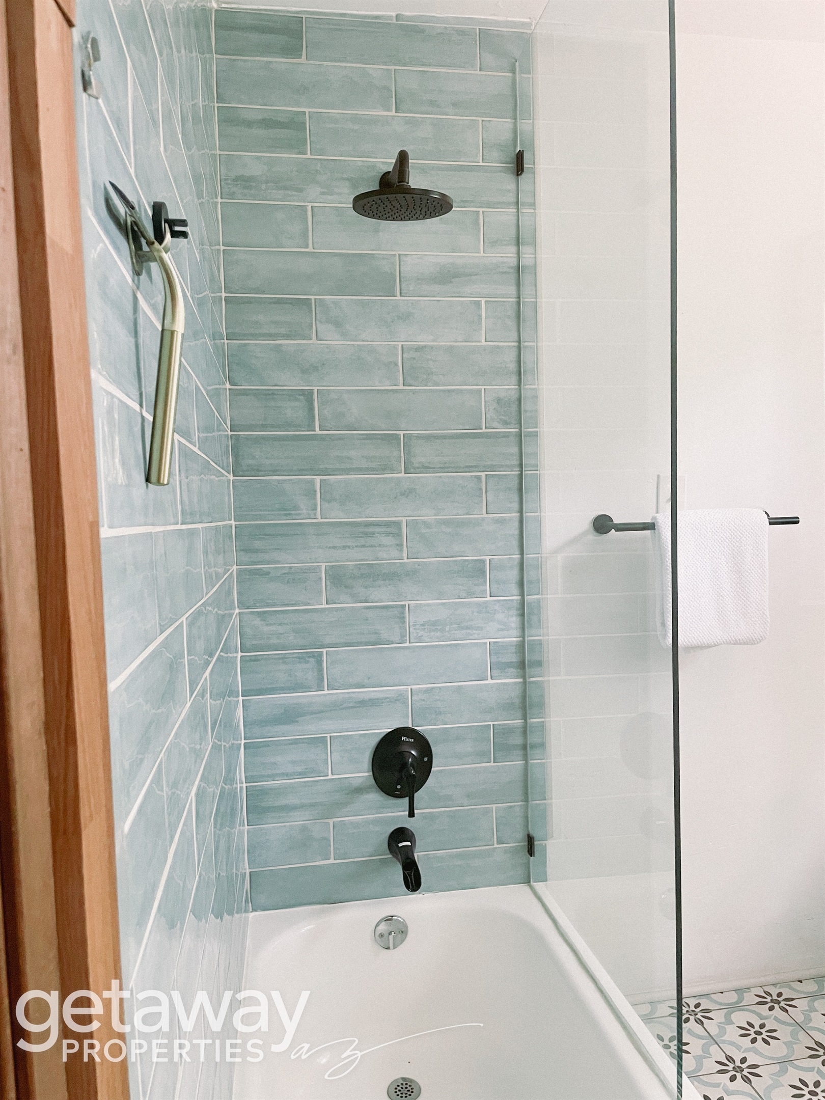Bright, clean full bathroom stocked with essentials for your stay