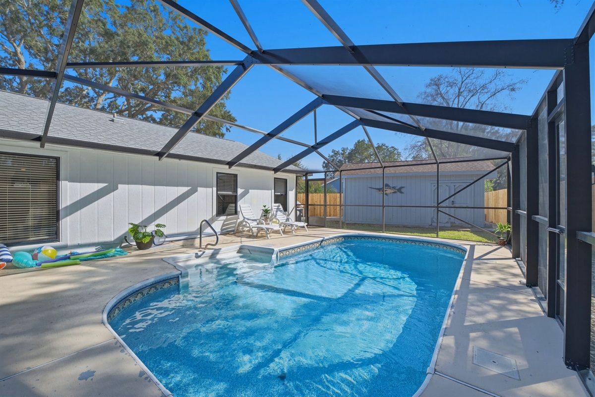 Take a refreshing dip in the private screened-in pool, designed for relaxing swims and sunny afternoons. Comfortable lounge chairs and the enclosed lanai provide a peaceful space to unwind while enjoying the outdoors.