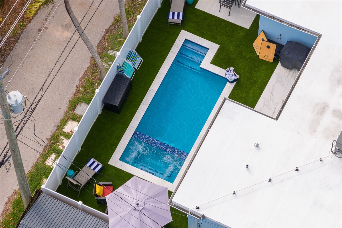 Beautiful 4 bedroom, 3 bathroom pool home in a family-friendly, safe neighborhood. Features a wide paver driveway, tropical palms, and welcoming curb appeal.