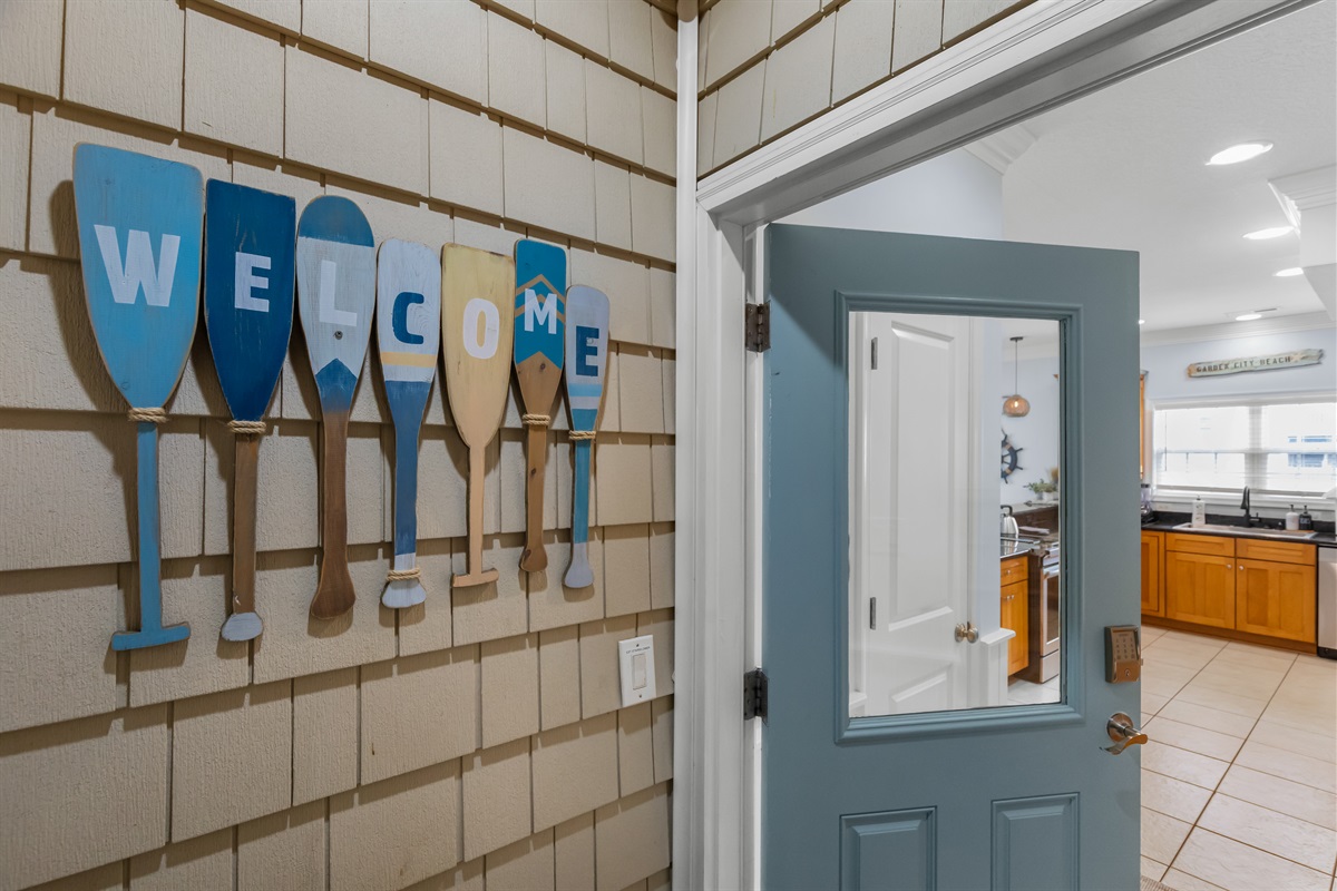 Entry door at top of the stairs from the ground level.