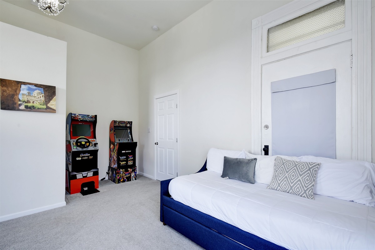 Bedroom 4: 1 Double Bed, 2 Twin Beds  The arcade room offers full-sized NBA Jam, Street Fighter and OutRun (racing game).