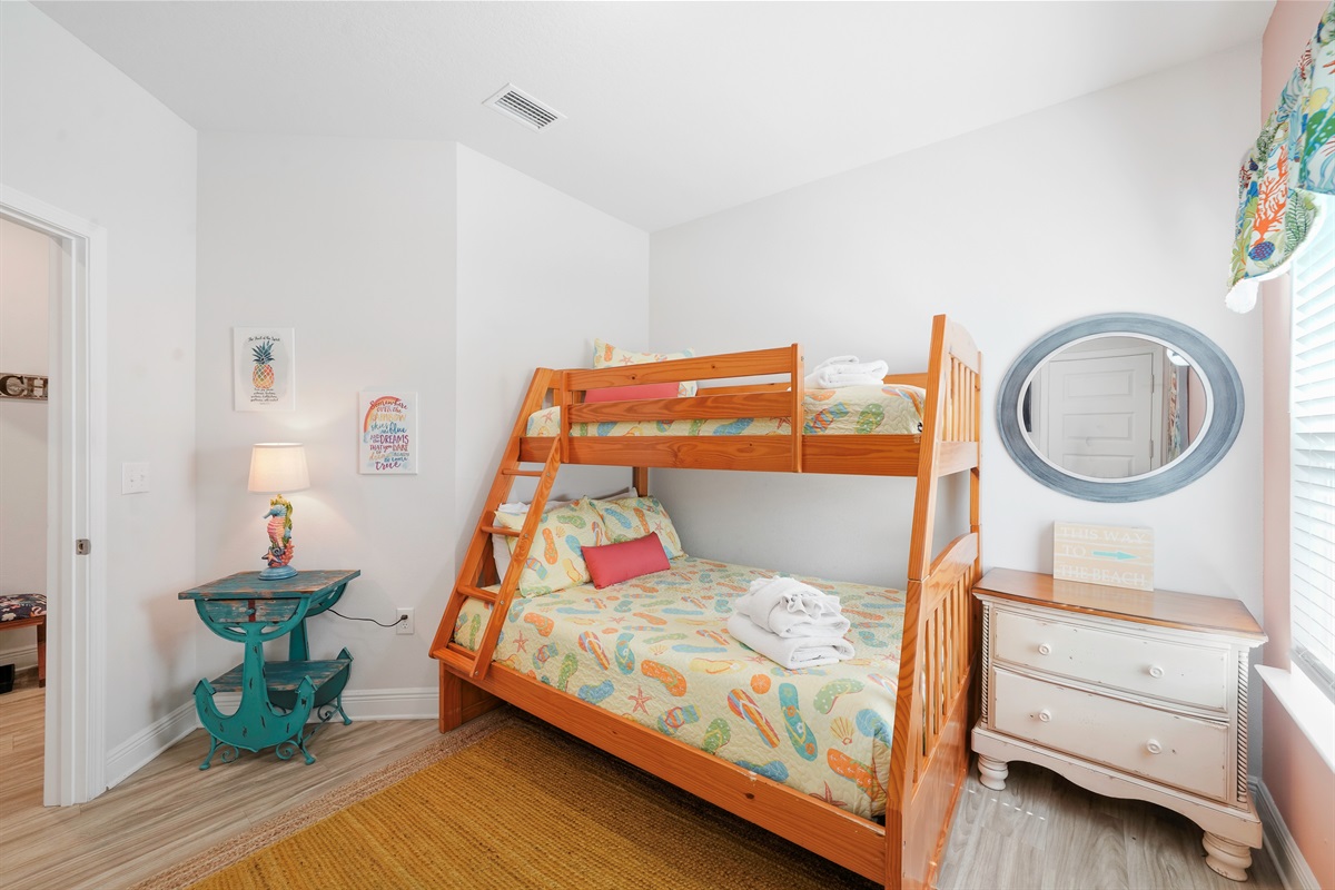 Bedroom 3: Twin-over-full bunk bed, Smart TV, dresser, and closet