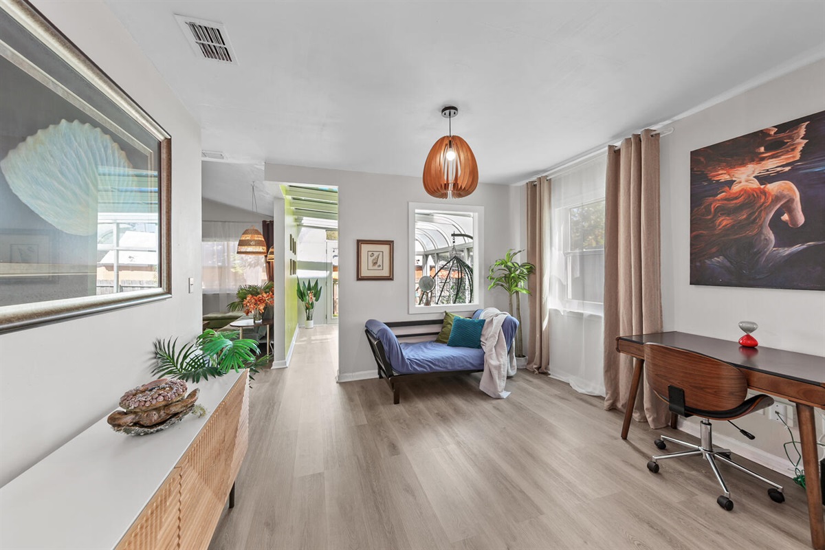 Entry has 1st workspace and couch that can be converted to bed