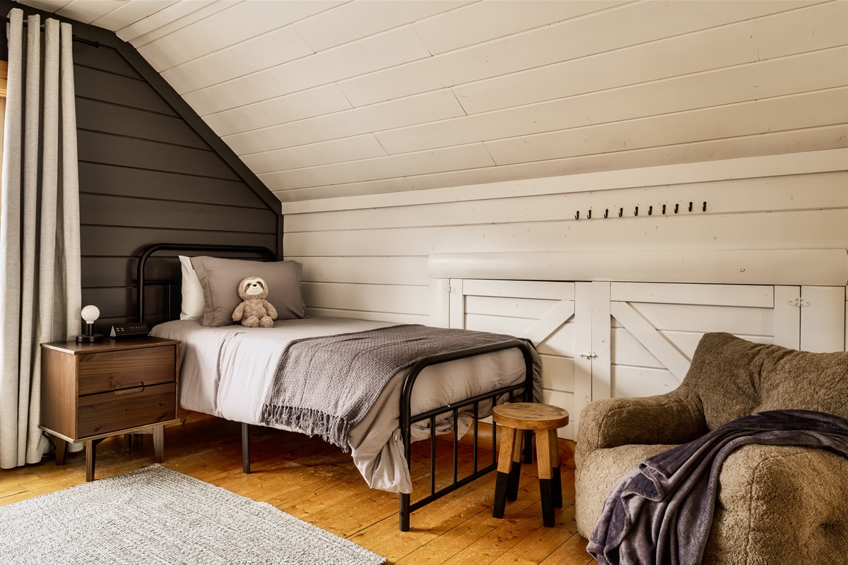 Cozy corners and double the dreams! Embracing the snug charm of twin beds tucked away in the attic.
