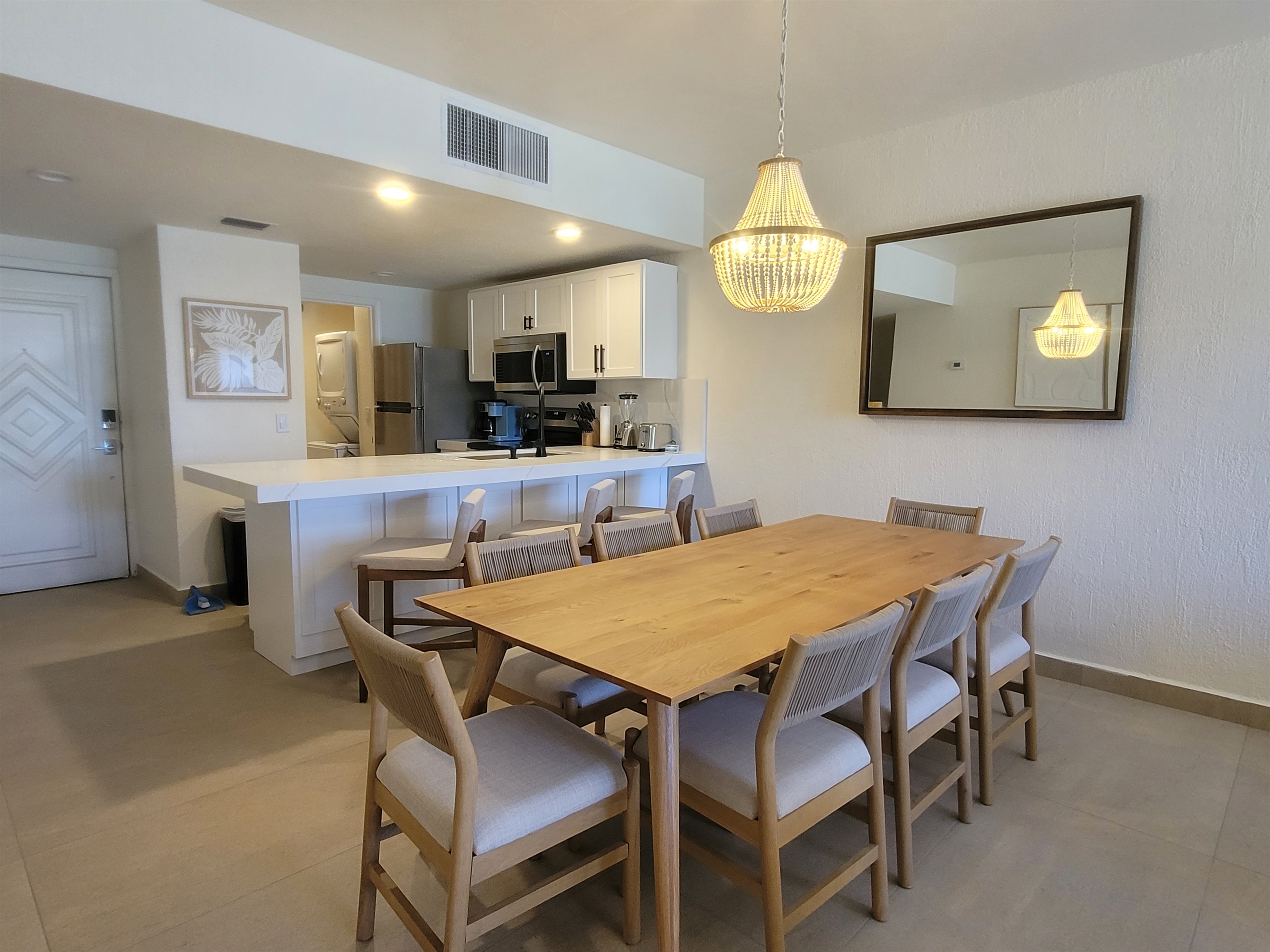 Dining room with extended table with seating for everyone. Giving a modern boho vibe.