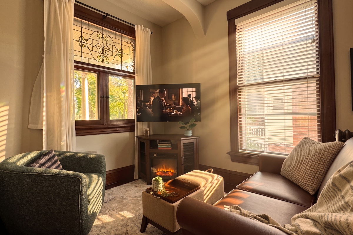 Relax in the coxy living room with padded ottoman to put your feet up or flip the tray to enjoy a meal and a show.