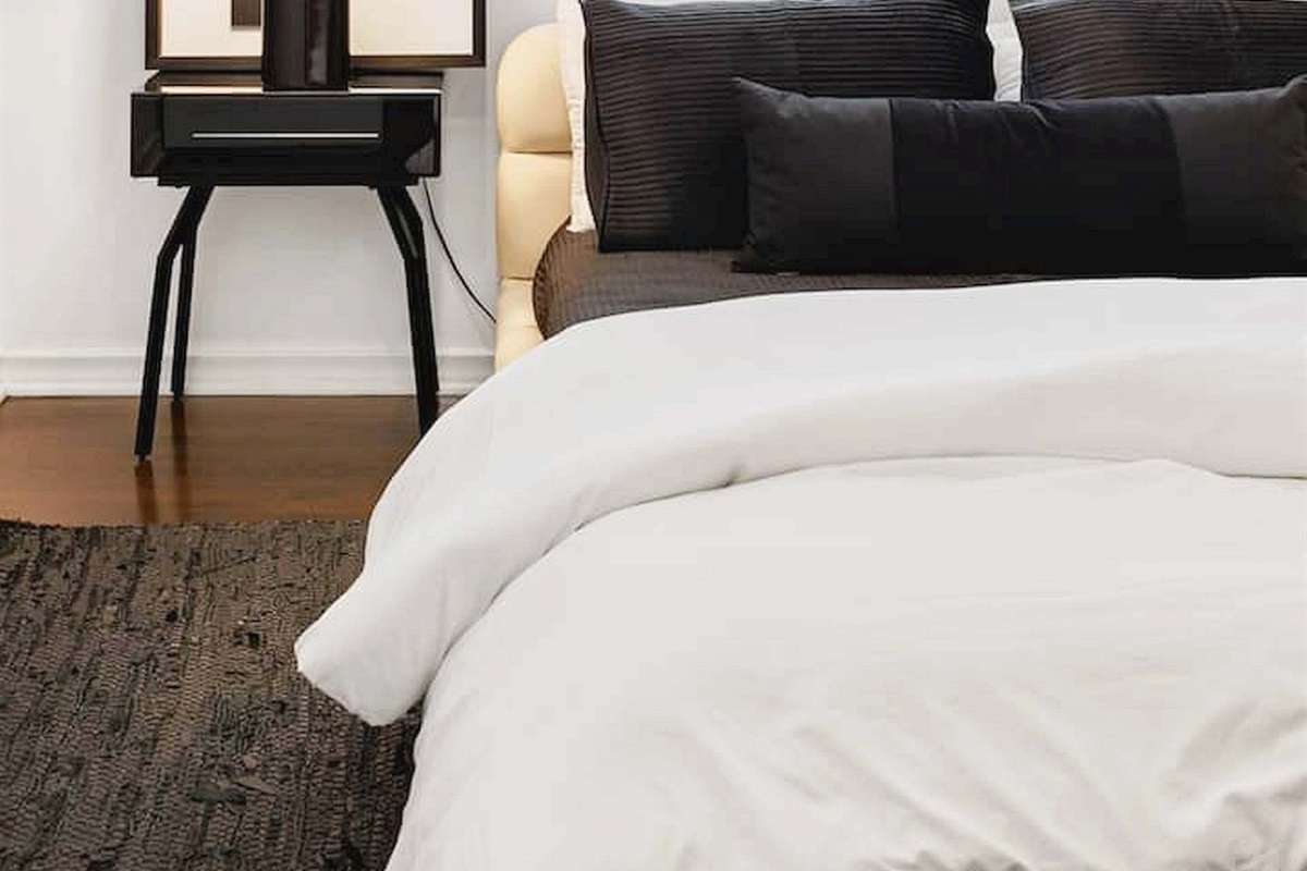 Soft bedding, modern accents, and warm natural light create a cozy and relaxing bedroom designed for a comfortable stay. ✨