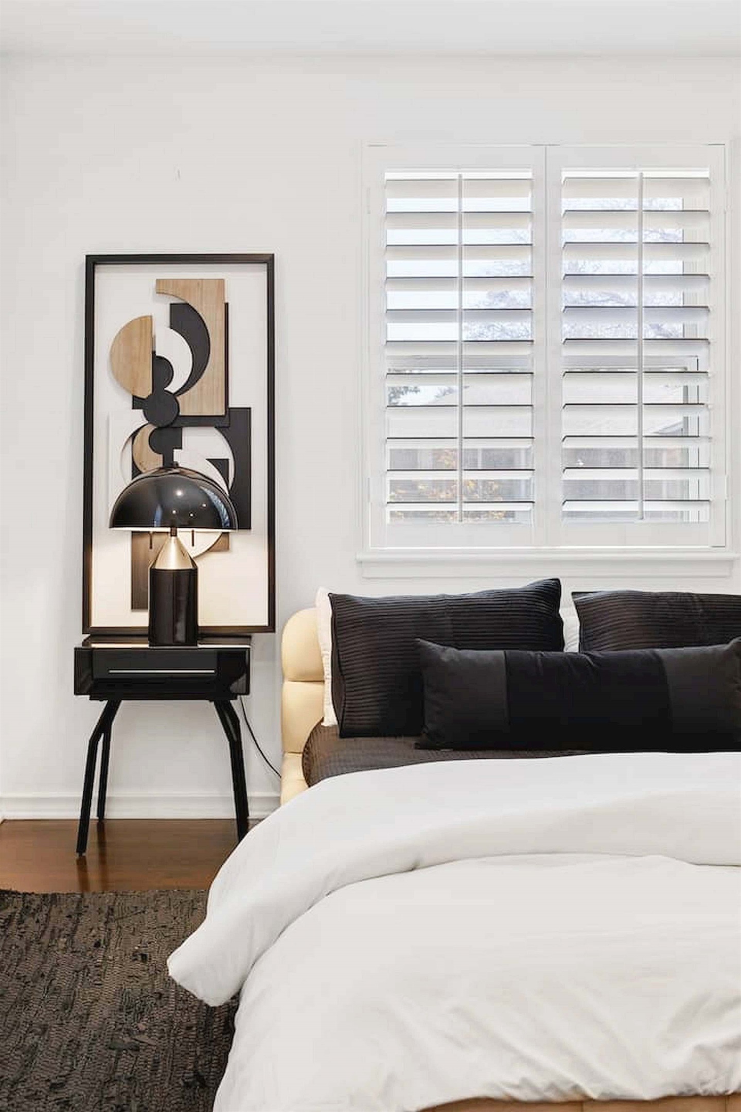 Soft bedding, modern accents, and warm natural light create a cozy and relaxing bedroom designed for a comfortable stay. ✨